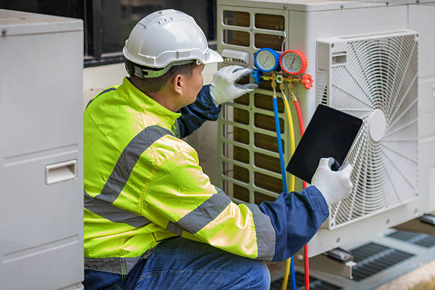 Professional Hvac technician working in Halls, TN
